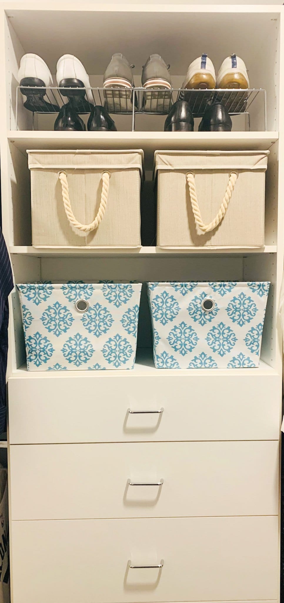 Closet organized with a shoe rack, fabric storage bins and drawers